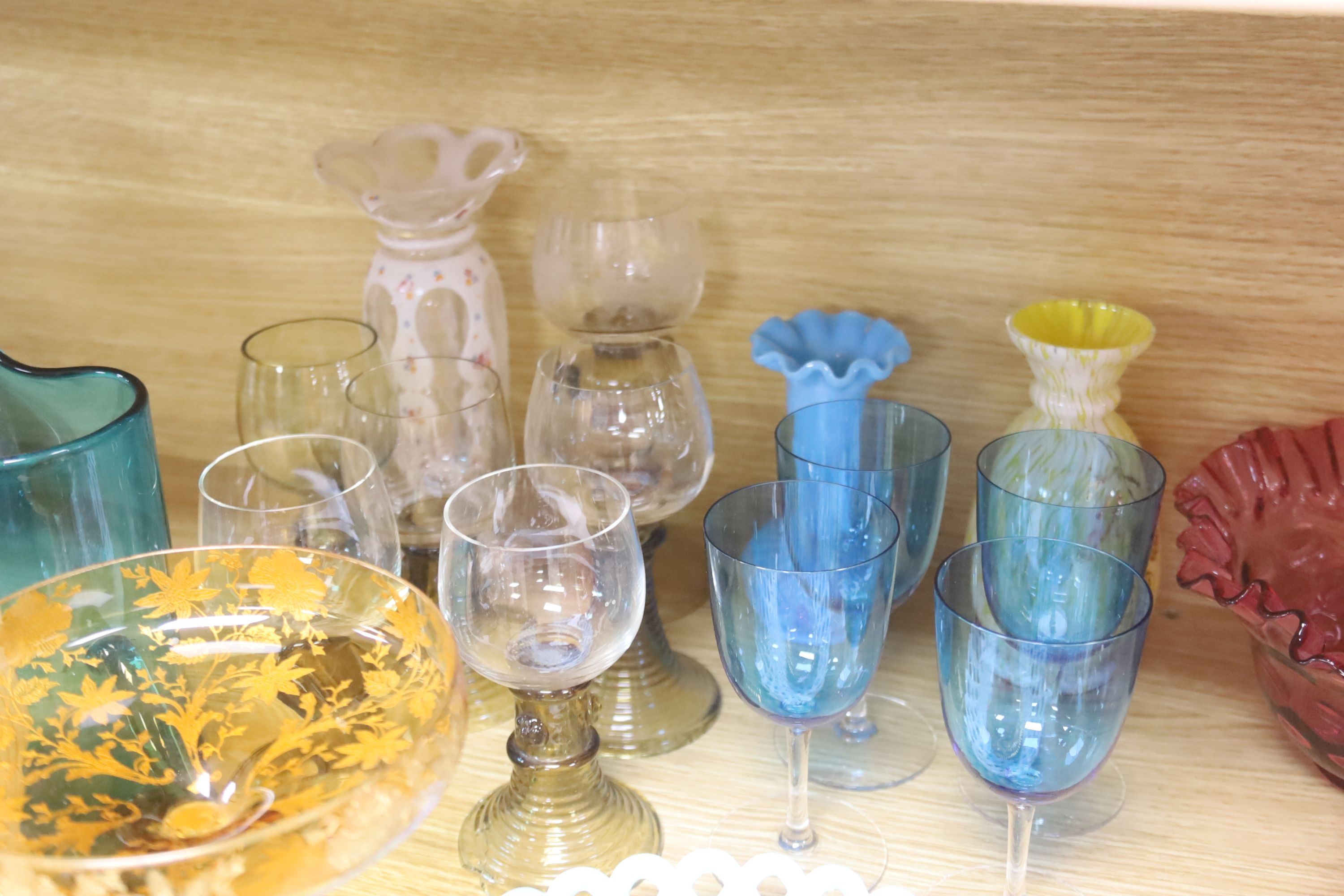 An assortment of 19th century and later coloured glassware including cranberry, Bohemian, Venetian etc.